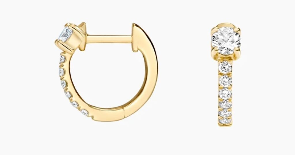 Brilliant Earth's 14K Yellow Gold Taylor Lab Diamond Huggie Earrings Image From Side and Main Angle.